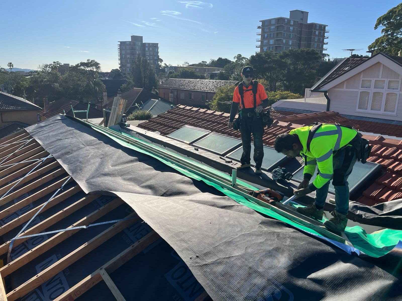 The Bay Brothers crew laying sarking and battens on a Sydney roof