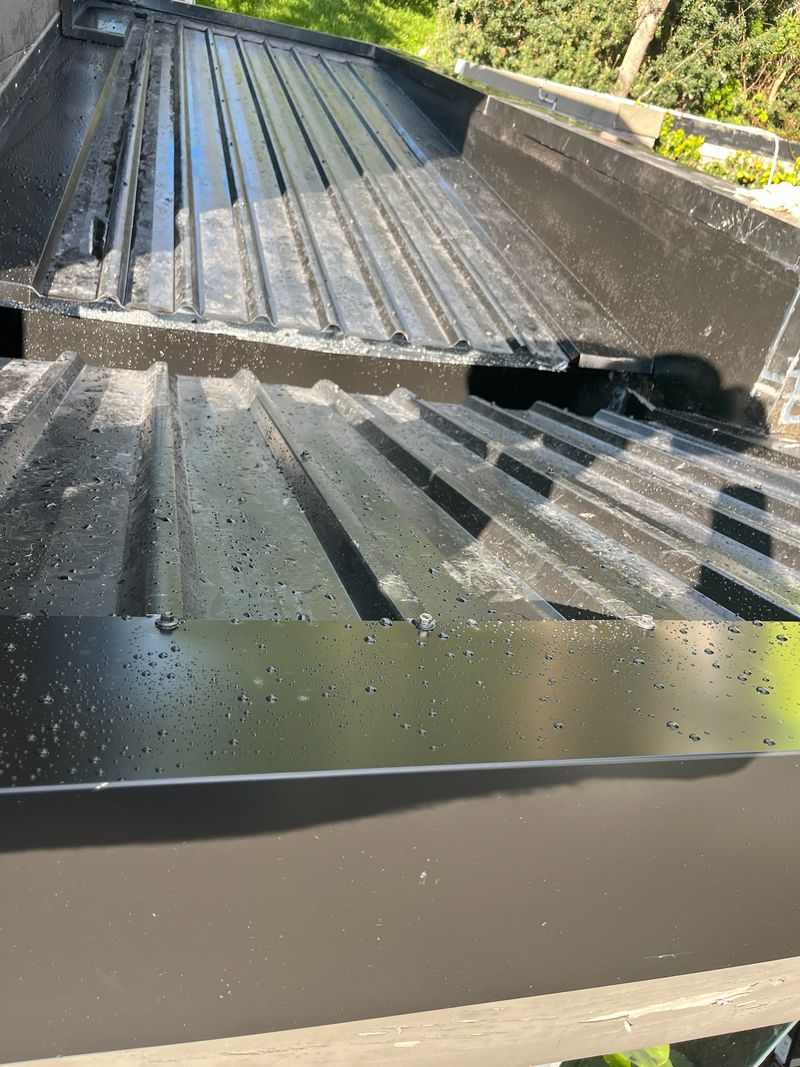 Detail of a finished dark metal roof